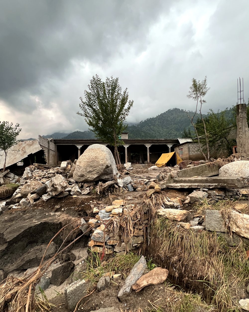 A flood-damaged village beneath the mountains of Khyber Pakhtunkhwa